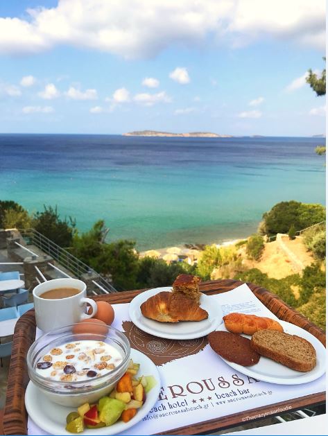 Breakfast with a view at Aneroussa Beach Hotel, Andros, Greece.
