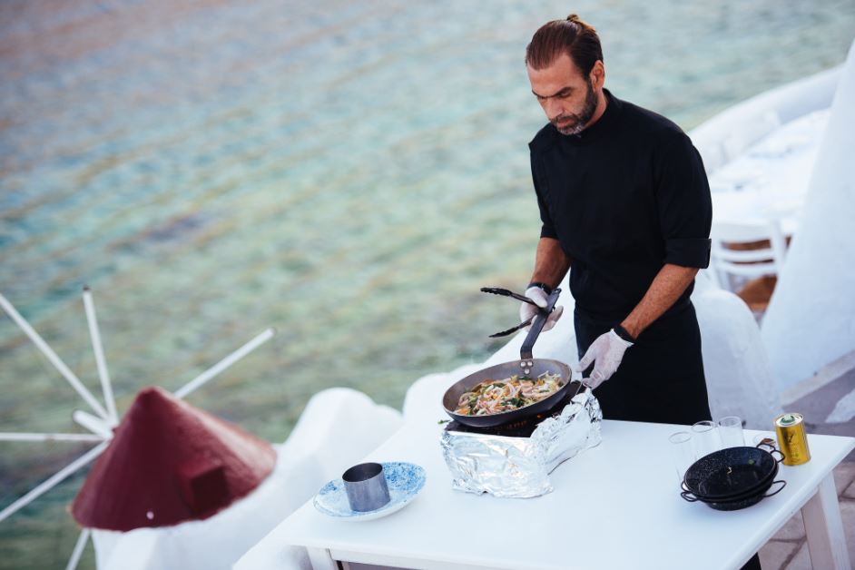 A Greek chef cooking local Greek food.